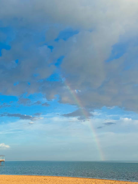 istock Rainbow on the seashore. Sky after rain and sand. 2152129410