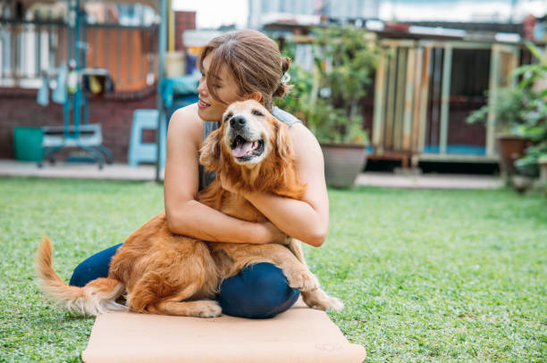istock Joy in the Backyard: A Bond Between Woman and Dog 2152132566