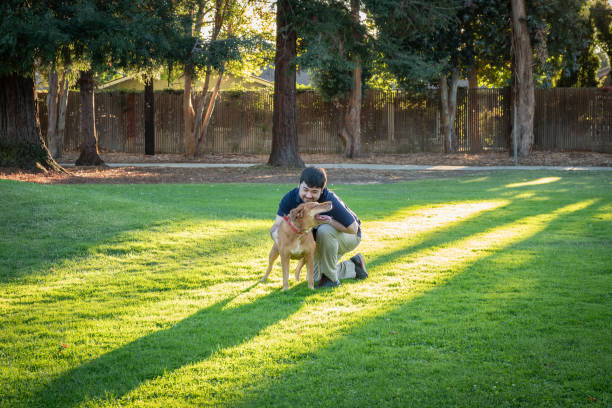 istock Multiracial Man and Rescue Dog Showing Affection for Each Other 2152134908