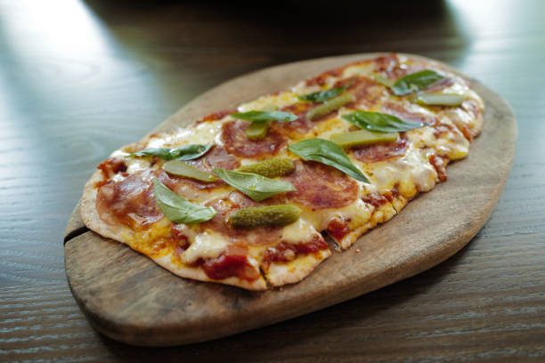 istock Close up pepperoni and cheese pizza with pickle 2152135594