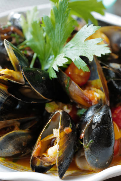 istock Close up steamed mussels pot 2152135660