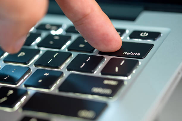 istock Finger of the computer user, he presses the delete button on the computer keyboard. 2152135760