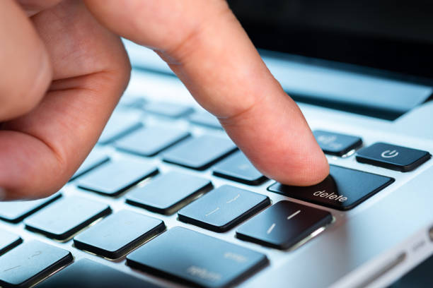 istock Finger of the computer user, he presses the delete button on the computer keyboard. 2152135762