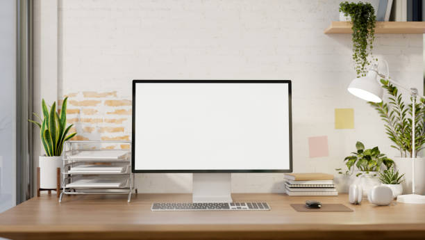 istock A contemporary minimalist home office features a computer mockup against a white rustic brick wall. 2152136094