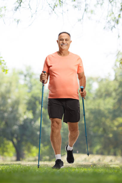 istock Mature man with walking poles 2152137358