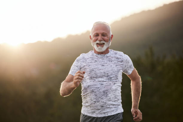 istock Happy mature athlete jogging in nature at sunset. 2152137368