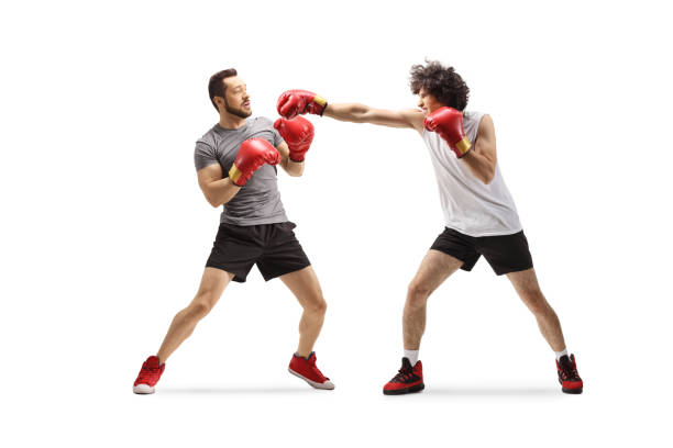 istock Young men fighting with boxing gloves 2152137707