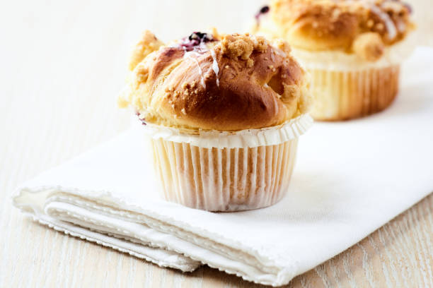 istock Muffins on bright wooden background. Close up. Copy space. 2152137728