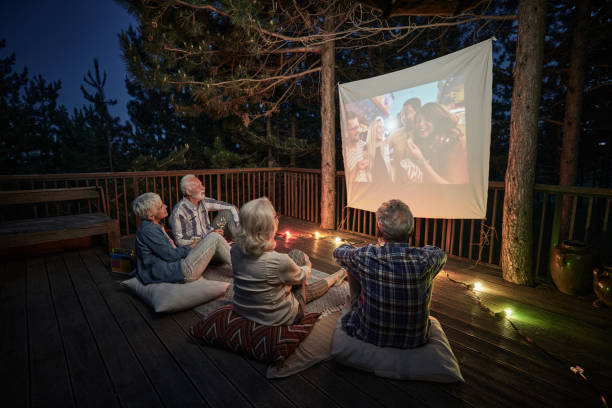 istock Mature couples relaxing during movie night on a terrace. 2152137953