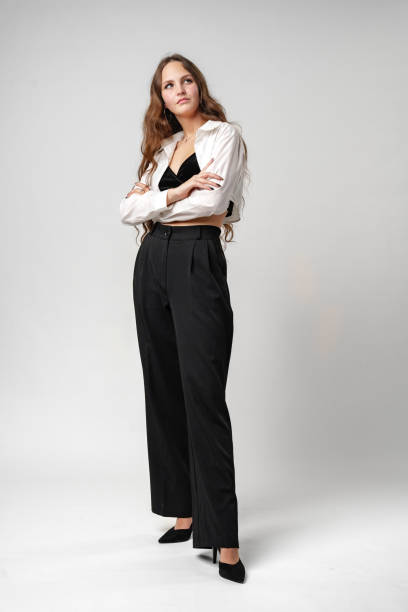 istock Woman in White Shirt and Black Pants 2152137996