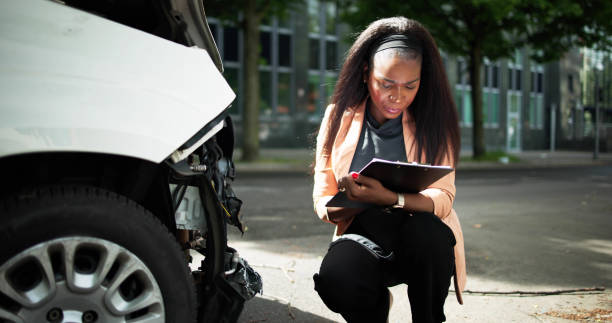 istock African American Car Insurance Agent Inspecting Accident 2152138921