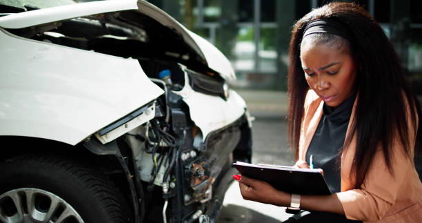 istock African American Car Insurance Agent Inspecting Accident 2152138928