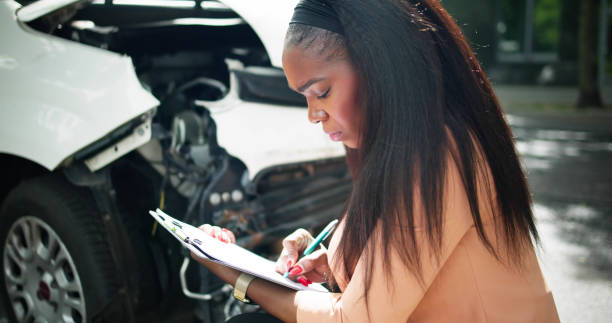 istock African American Car Insurance Agent Inspecting Accident 2152138930