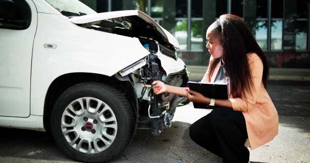 istock African American Car Insurance Agent Inspecting Accident 2152138936