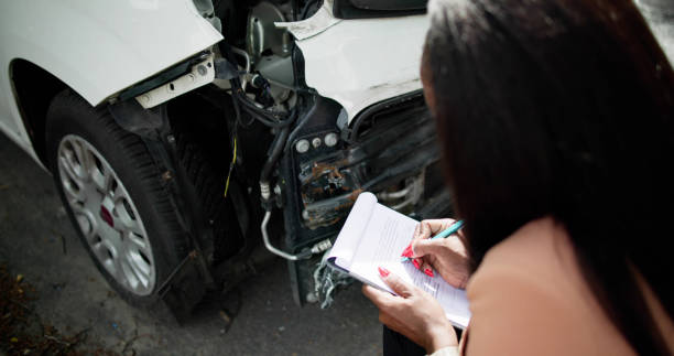 istock African American Car Insurance Agent Inspecting Accident 2152138976