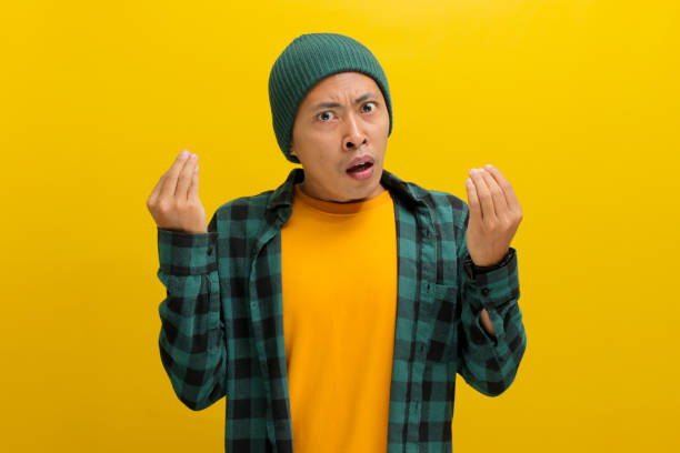 istock Young Asian man is gesturing a typical Italian hand gesture towards the camera 2152138978