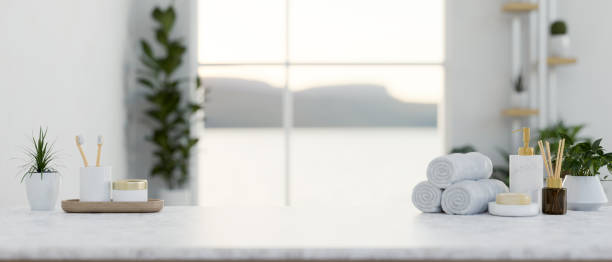 istock A luxury white marble tabletop features toiletries and a copy space in a modern white bathroom. 2152139558