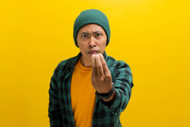 istock Young Asian man is making the Italian hand gesture with pinched fingers 2152140007