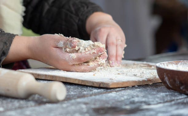 istock A woman kneads the dough with her hands 2152140491