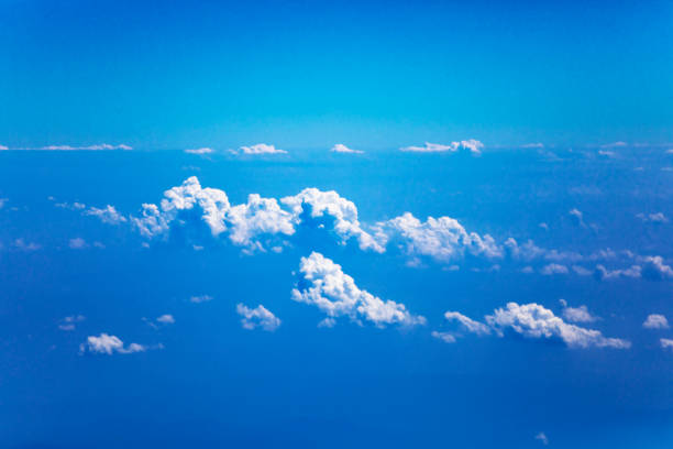 Cumulus clouds over mountains n Chiang Mai province seen from airplane