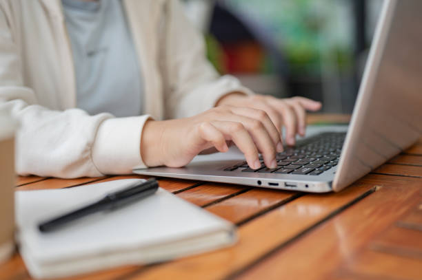 istock A close-up image of a woman using her laptop computer, typing on the laptop keyboard. 2152142742