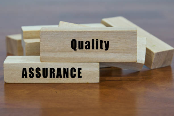 istock Quality Assurance word on wooden blocks. 2152143079