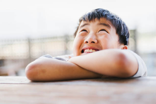 Asian boy making funny face.