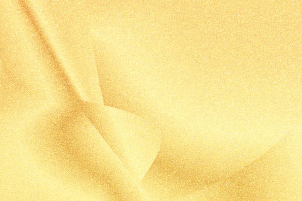 abstract gold color glitter paper. natural grunge texture background. wave pattern. retro styled concept.