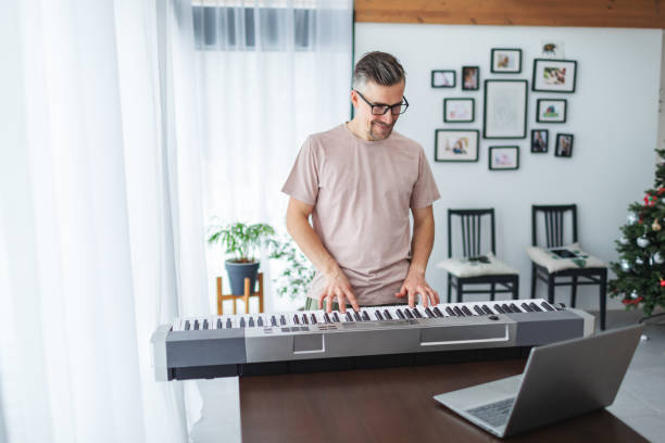 istock Playing the electric piano with teacher 2152143783