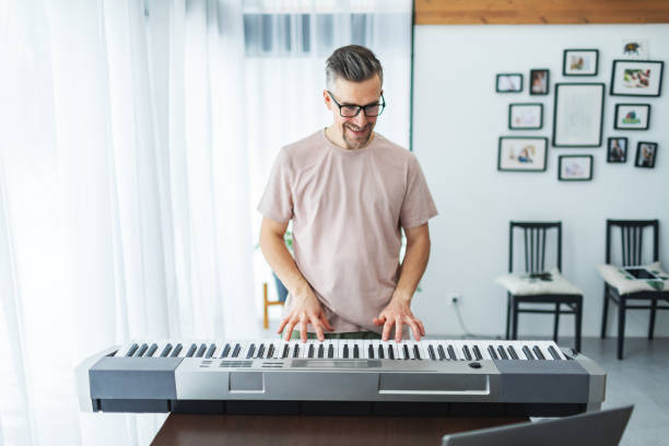 Playing the electric piano with teacher