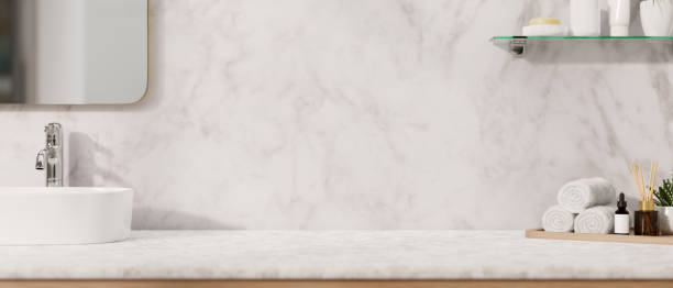 istock A modern, luxurious white marble bathroom countertop features a sink, a mirror, a toiletry set. 2152145021