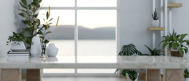 istock A coffee table surrounded by indoor houseplants in a minimal contemporary room. 2152145500