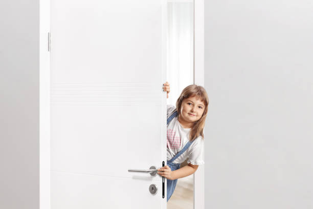 istock Little girl opening a door 2152148511