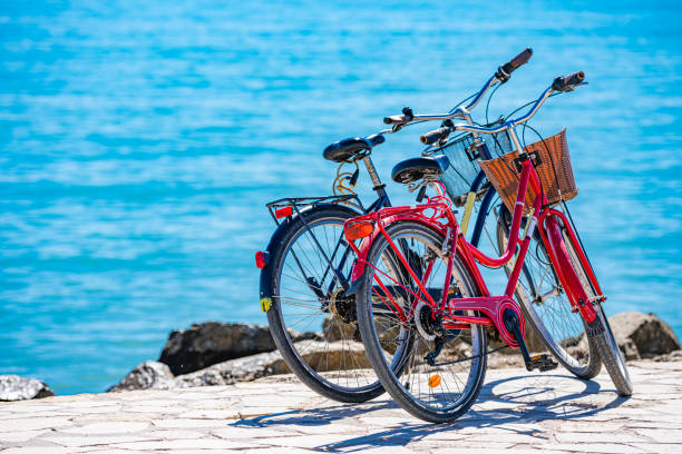 Two bycicles parked by the sea. High resolution 42Mp outdoors digital capture taken with Sony A7rII and Canon EF 70-200mm f/2.8L IS II USM Telephoto Zoom Lens