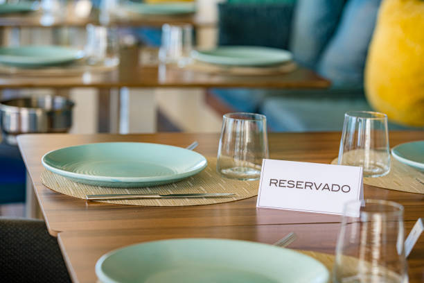 istock Close up of a reservation sign in Spanish language on multicolored restaurant table. Selective focus 2152151225