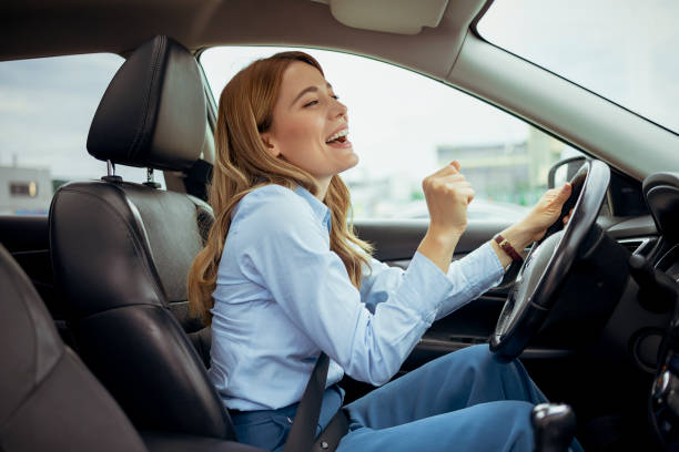 Woman on Driver Seat Singing Song While Driving