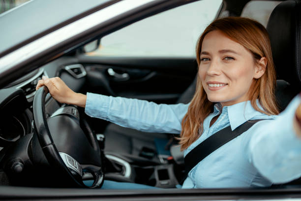 istock Woman Making Selfie While Driving a Car 2152151428