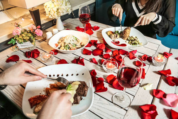istock Couple Enjoying a Meal Together at a Table 2152152351