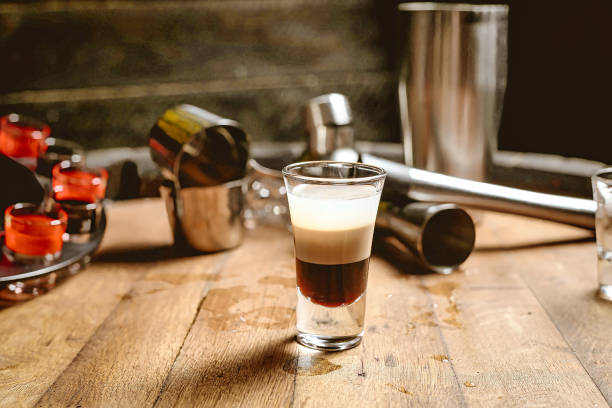 istock Wooden Table With Shot Glass Filled With Liquid 2152152678
