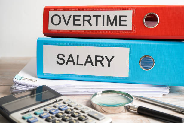 istock Overtime, Salary. Binder data finance report business with graph analysis in office. 2152155613