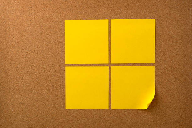 Blank sticky note paper on cork board wall. Noticeboard to organize life and work concept