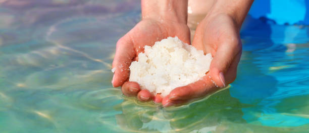 istock Female hands with sea salt for spa from Dead Sea 2152156639
