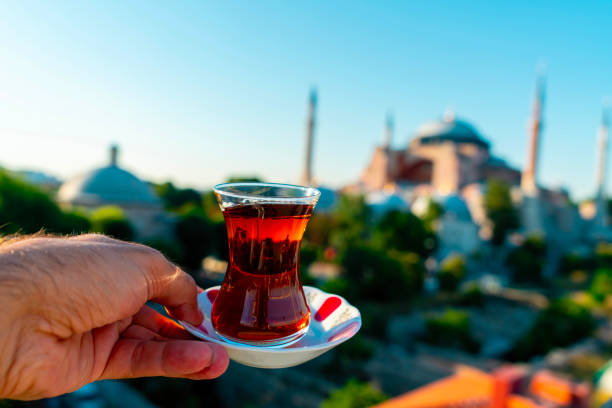 istock A man drinks Turkish tea opposite the Hagia Sophia Mosque. The man drinks his tea while admiring the view. Istanbul Turkey. 2152160513