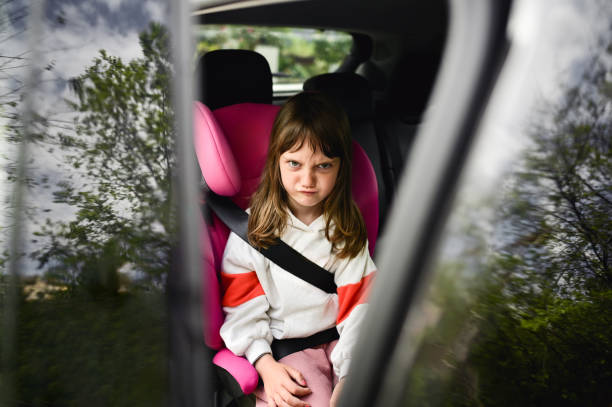 istock Child making face inside of a car. 2152161407