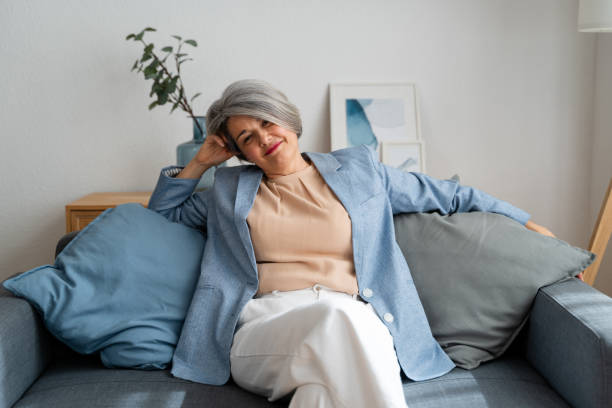 istock Relaxed senior woman enjoying cozy home atmosphere 2152161409