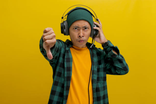 istock Music in His Ears, Thumbs Down for the Song 2152161481