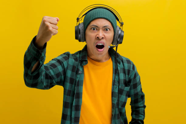 istock Frustrated Asian Man Listening Music 2152161501