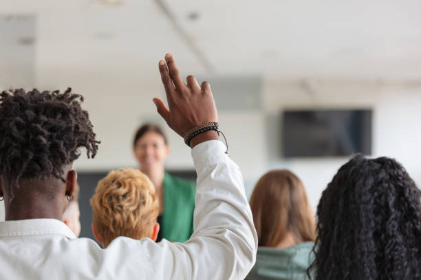 istock Female teacher giving presentation to university students 2152161583