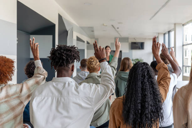 istock Female teacher giving presentation to university students 2152161627
