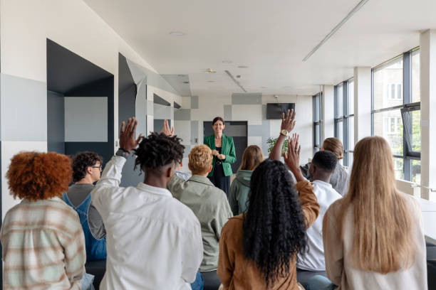 istock Female teacher giving presentation to university students 2152161735